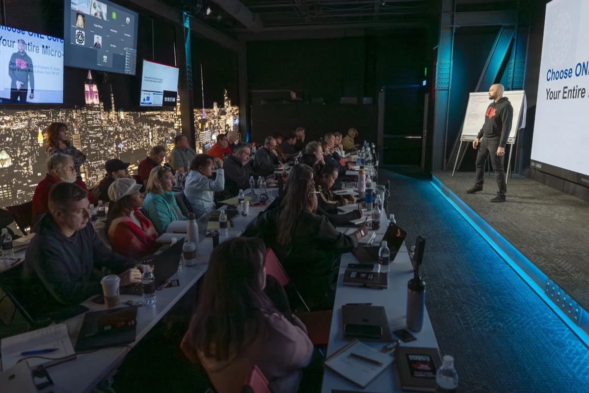 A packed studio audience watching a presenter
